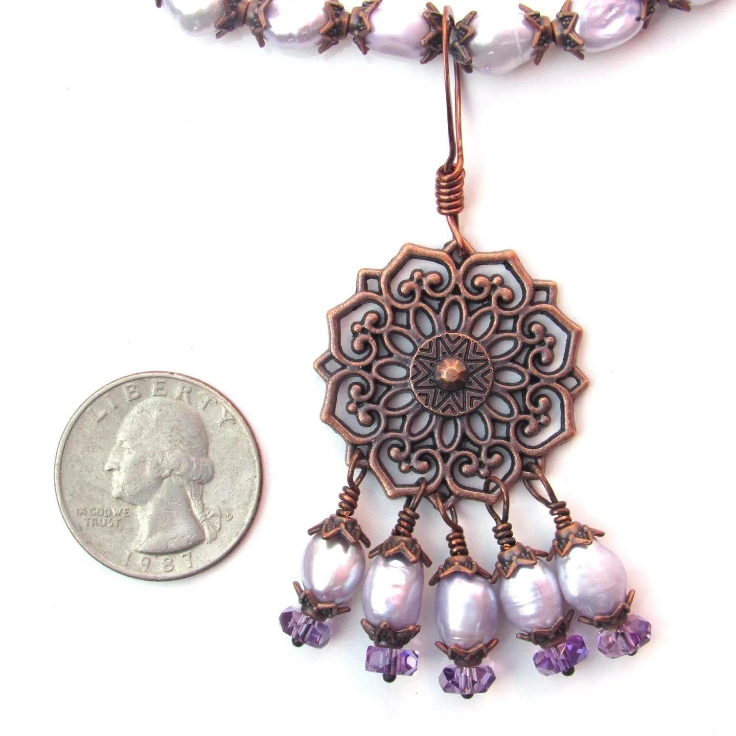 Purple freshwater pearls, amethyst gemstones, and copper chain and pendant design.