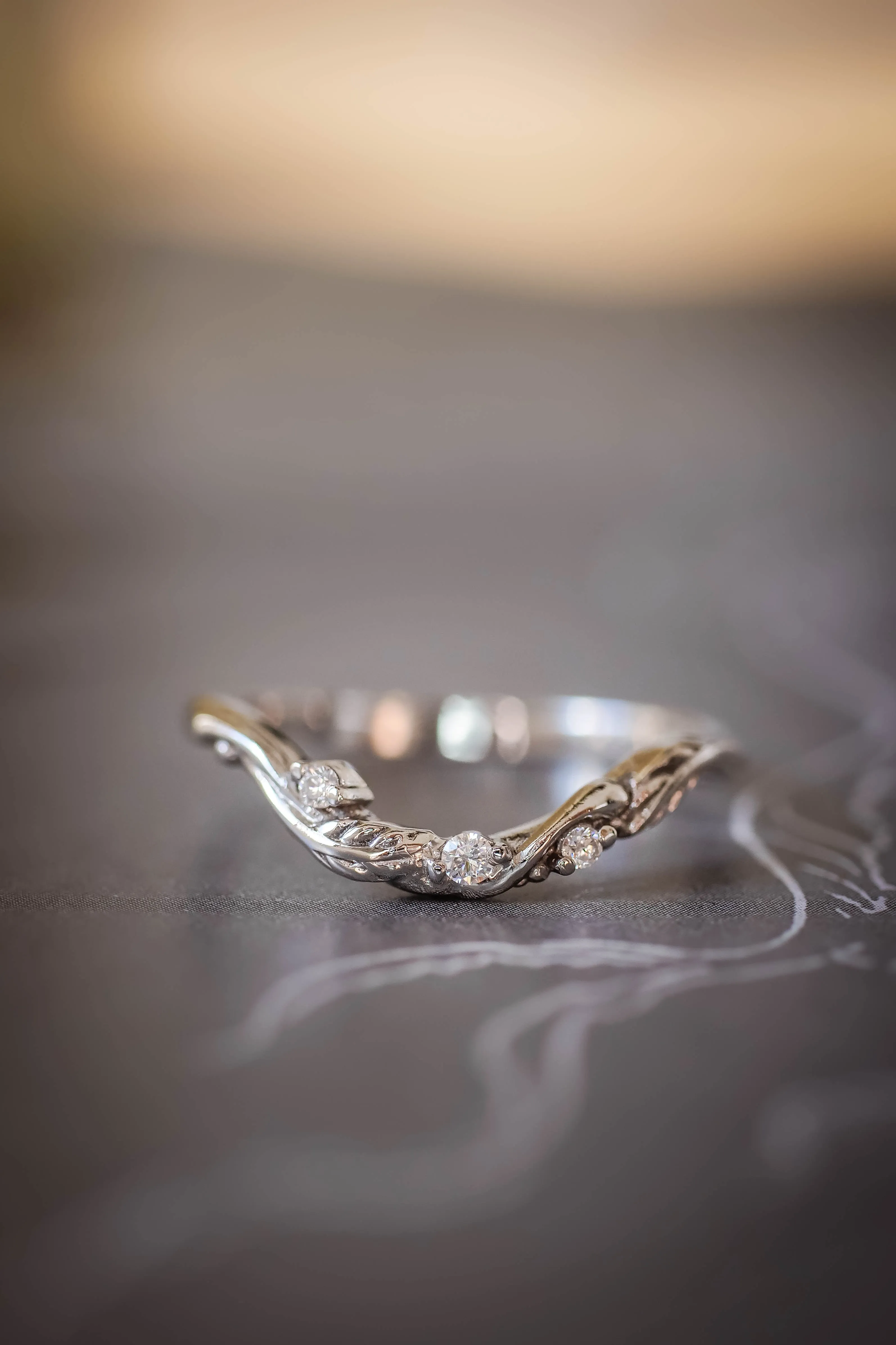 Wedding rings set for couples: classic band for him, curved leaf band for her